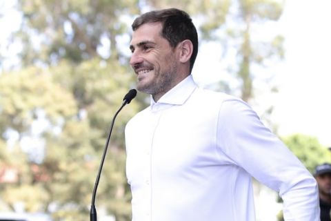 Spanish goalkeeper Iker Casillas smiles while talking to journalists outside a hospital in Porto, Portugal, Monday, May 6, 2019. Veteran goalkeeper Iker Casillas had a heart attack during a training session with his Portuguese club FC Porto and was hospitalized May 1. (AP Photo/Luis Vieira)