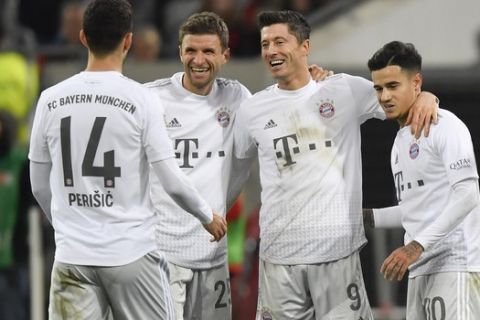 Bayern's Ivan Perisic, from left, Thomas Mueller, Robert Lewandowski and Philippe Coutinho celebrate after scoring during the German Bundesliga soccer match between Fortuna Duesseldorf and FC Bayern Munich in Duesseldorf, Germany, Saturday, Nov. 23, 2019. (AP Photo/Martin Meissner)