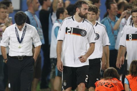 Germany's head coach Joachim Loew, 2nd left, walks away after receiving his losers medal at the end of the Euro 2008 final between Germany and Spain in the Ernst-Happel stadium in Vienna, Austria, Sunday, June 29, 2008. Germany lost 0-1. (AP Photo/Jon Super)