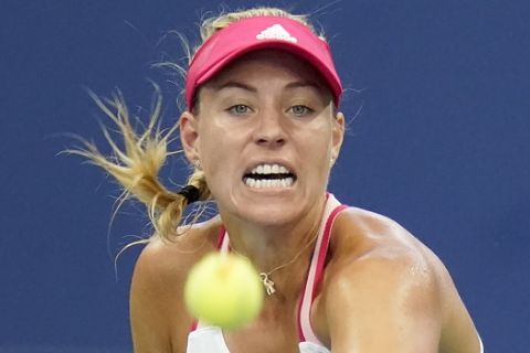 Angelique Kerber, of Germany, returns a shot to Anna-Lena Friedsam, of Germany, during the second round of the US Open tennis championships, Wednesday, Sept. 2, 2020, in New York. (AP Photo/Seth Wenig)