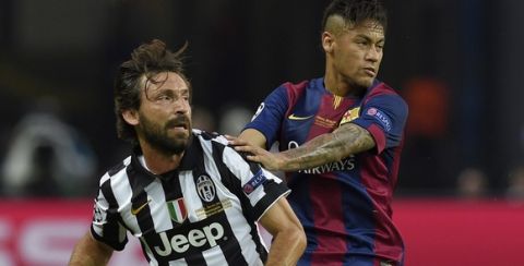 Juventus' midfielder Andrea Pirlo (L) and Barcelona's Brazilian forward Neymar da Silva Santos Junior vie for the ball during the UEFA Champions League Final football match between Juventus and FC Barcelona at the Olympic Stadium in Berlin on June 6, 2015.     AFP PHOTO / LLUIS GENE        (Photo credit should read LLUIS GENE/AFP/Getty Images)