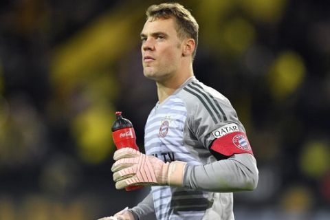 FILE - In this Saturday, Nov. 10, 2018 file photo Bayern goalkeeper Manuel Neuer leaves the pitch during the German Bundesliga soccer match against Borussia Dortmund in Dortmund, Germany. Bayern Munich captain Manuel Neuer has been ruled out of the side's Bundesliga game at Bayer Leverkusen tomorrow. The six-time defending champion says its 32-year-old goalkeeper injured his right hand in training on Friday and is remaining in Munich rather than traveling with the rest of the squad. (AP Photo/Martin Meissner)