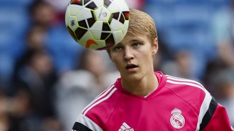 Real Madrid's Martin Odegaard from Norway, plays with the ball as he warms up before a Spanish La Liga soccer match between Real Madrid and Almeria at the Santiago Bernabeu stadium in Madrid, Spain, Wednesday, April 29, 2015. (AP Photo/Daniel Ochoa de Olza)