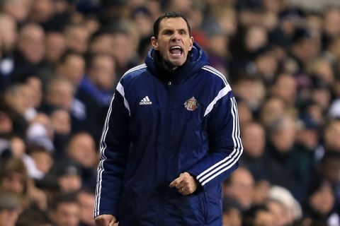 Sunderland manager Gus Poyet on the touchline during the Barclays Premier League match at White Hart Lane, London. PRESS ASSOCIATION Photo. Picture date: Saturday January 17, 2015. See PA story SOCCER Tottenham. Picture credit should read Stephen Pond/PA Wire. RESTRICTIONS: Editorial use only. Maximum 45 images during a match. No video emulation or promotion as 'live'. No use in games, competitions, merchandise, betting or single club/player services. No use with unofficial audio, video, data, fixtures or club/league logos.