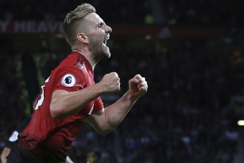 Manchester United's Luke Shaw celebrates after scoring his sides second goal of the game during the English Premier League soccer match between Manchester United and Leicester City at Old Trafford, in Manchester, England, Friday, Aug. 10, 2018. (AP Photo/Jon Super)