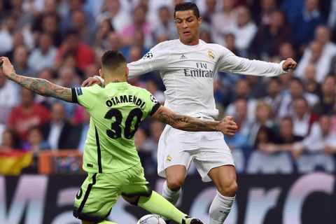 "Real Madrid's Portuguese forward Cristiano Ronaldo (R) vies with Manchester City's Argentinian defender Nicolas Otamendi during the UEFA Champions League semi-final second leg football match Real Madrid CF vs Manchester City FC at the Santiago Bernabeu stadium in Madrid, on May 4, 2016. / AFP / PAUL ELLIS        (Photo credit should read PAUL ELLIS/AFP/Getty Images)"