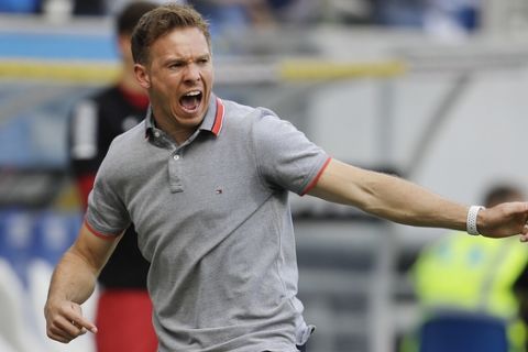 FILE - In this May 12, 2018 file photo Hoffenheim's head coach Julian Nagelsmann celebrates his side's second goal during a German first division Bundesliga soccer match between TSG 1899 Hoffenheim and Borussia Dortmund in Sinsheim, Germany. (AP Photo/Michael Probst, file)