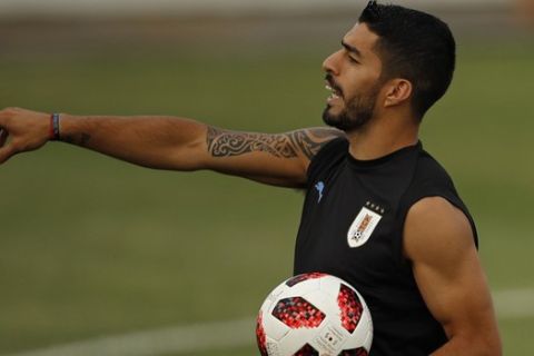 Uruguay's Luis Suarez gestures during Uruguay's official training on the eve of the round of 16 match between Portugal and Uruguay at the 2018 soccer World Cup in Sochi, Russia, Friday, June 29, 2018. (AP Photo/Francisco Seco)