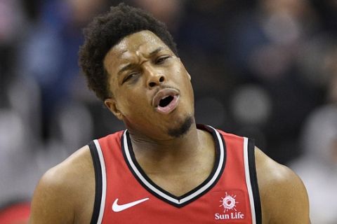 Toronto Raptors guard Kyle Lowry (7) reacts during the second half of an NBA basketball game against the Washington Wizards, Sunday, Jan. 13, 2019, in Washington. The Raptors won 140-138 in double overtime. (AP Photo/Nick Wass)