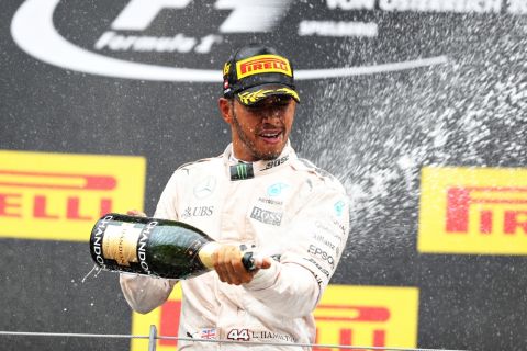 SPIELBERG, AUSTRIA - JULY 03: Lewis Hamilton of Great Britain and Mercedes GP celebrates winning the race on the podium during the Formula One Grand Prix of Austria at Red Bull Ring on July 3, 2016 in Spielberg, Austria.  (Photo by Mark Thompson/Getty Images)