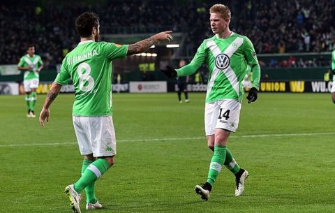 Wolfsburg's Belgian midfielder Kevin De Bruyne (R) celebrates after scoring his team's second goal with Wolfsburg's Portuguese striker Vieirinha during the UEFA Europa League first-leg, Round of 16 football match VfL Wolfsburg vs FC Internazionale Milano in Wolfsburg, northern Germany on March 12, 2015.      AFP PHOTO / RONNY HARTMANN        (Photo credit should read RONNY HARTMANN/AFP/Getty Images)