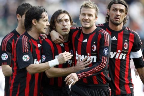 AC Milan midfielder Andrea Pirlo, third left, celebrates after scoring on a penalty kick with his teammates Filippo Inzaghi, left, David Beckham and Paolo Maldini, right, during the Serie A soccer match between Siena and AC Milan, at Siena's Artemio Franchi Stadium, Sunday March 15, 2009.  (AP Photo/Alessandra Tarantino)