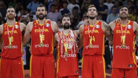 Members of Spain's team stand with their gold medals after beating Argentina in their first-place match in the FIBA Basketball World Cup at the Cadillac Arena in Beijing, Sunday, Sept. 15, 2019. (AP Photo/Mark Schiefelbein)