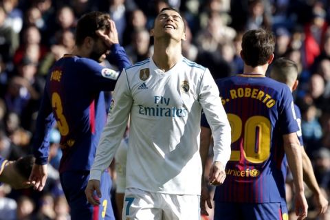 Real Madrid's Cristiano Ronaldo reacts during the Spanish La Liga soccer match between Real Madrid and Barcelona at the Santiago Bernabeu stadium in Madrid, Spain, Saturday, Dec. 23, 2017. (AP Photo/Paul White)