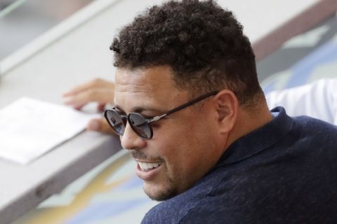 FILE - In this June 30, 2018 file photo, Brazil's former player Ronaldo watches a match between France and Argentina, at the 2018 soccer World Cup at the Kazan Arena in Kazan, Russia. Former Brazil striker Ronaldo is taking over recently promoted Spanish club Valladolid. Ronaldo announced Monday, Sept. 3 he has become the majority stakeholder in the small club from northern Spain. The former star says he hopes to bring his soccer expertise to help the club improve and be successful in the top tier of the Spanish league. (AP Photo/Sergei Grits, File)