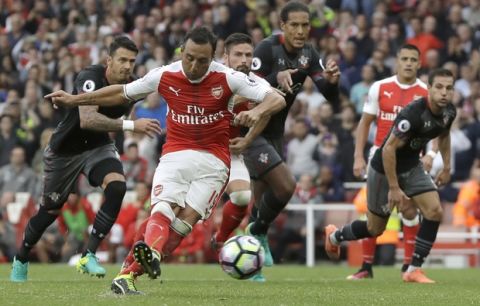 Arsenal's Santi Cazorla scores against Southampton during the English Premier League soccer match between Arsenal and Southampton at Emirates stadium in London, Saturday, Sept. 10, 2016. (AP Photo/Kirsty Wigglesworth)