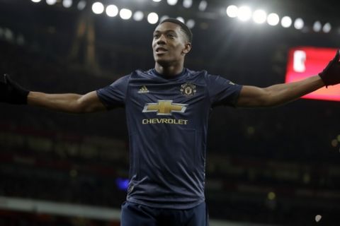 Manchester United's Anthony Martial celebrates after scoring his side's third goal during the English FA Cup fourth round soccer match between Arsenal and Manchester United at the Emirates stadium in London, Friday, Jan. 25, 2019. (AP Photo/Matt Dunham)