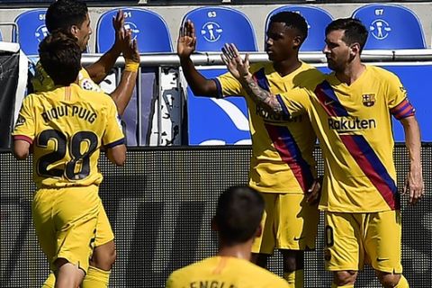 Barcelona players celebrated a goal against Alaves during the Spanish La Liga soccer match between Alaves and FC Barcelona, at Mendizorroza stadium, in Vitoria, northern Spain, Sunday, July 19, 2020. (AP Photo/Alvaro Barrientos)