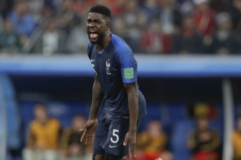 France's Samuel Umtiti celebrates at the end of the semifinal match between France and Belgium at the 2018 soccer World Cup in the St. Petersburg Stadium, in St. Petersburg, Russia, Tuesday, July 10, 2018. France won 1-0. (AP Photo/Petr David Josek)