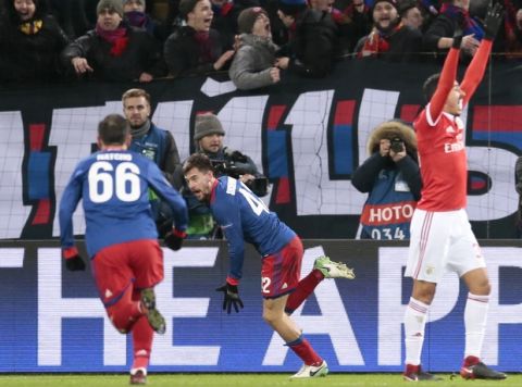 CSKA's Georgiy Shchennikov, centre, celebrates his team's first goal with Bebars Natcho, during the Champions League Group A soccer match between CSKA Moscow and Benfica in Moscow, Russia, Wednesday, Nov. 22, 2017. (AP Photo/Ivan Sekretarev)