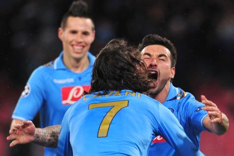 Napoli's Argentine forward Ezequiel Ivan Lavezzi (R) celebrates vwith Urugayan Cavani and Napoli's Slovak midfielder Marek Hamsik (back) after scoring during the Champions League round of 16 first leg football match, Napoli vs Chelsea at San Paolo stadium in Naples on February 21, 2012.   AFP PHOTO / ALBERTO PIZZOLI (Photo credit should read ALBERTO PIZZOLI/AFP/Getty Images)