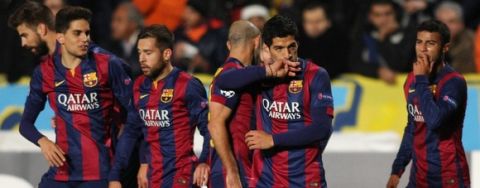 Barcelona's Uruguayan forward Luis Suarez (2R) celebrates with his teammates after scoring a goal during their UEFA Champions League football match against Apeol at the Neo GSP Stadium in the Cypriot capital, Nicosia, on November 25, 2014.AFP PHOTO/ SAKIS SAVVIDES        (Photo credit should read SAKIS SAVVIDES/AFP/Getty Images)