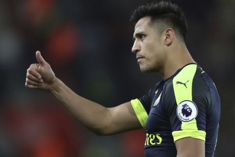 Arsenal's Alexis Sanchez gives a thumbs up during the English Premier League soccer match between Southampton and Arsenal at St Mary's stadium in Southampton, England, Wednesday, May 10, 2017. (AP Photo/Alastair Grant)