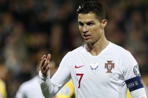Portugal's Cristiano Ronaldo gestures during the Euro 2020 group B qualifying soccer match between Lithuania and Portugal at LFF stadium in Vilnius, Lithuania, Tuesday, Sept. 10, 2019. (AP Photo/Mindaugas Kulbis)