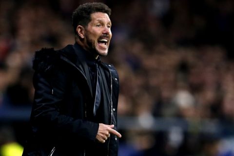 Atletico Madrid's head coach Diego Simeone shouts to his players from the sidelines during the Group A Champions League soccer match between Atletico Madrid and Borussia Dortmund at the Wanda Metropolitano stadium in Madrid, Spain, Tuesday, Nov. 6, 2018. (AP Photo/Paul White)