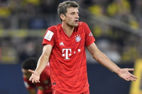 Bayern's Thomas Mueller reacts during the German Supercup soccer match between Borussia Dortmund and Bayern Munich in Dortmund, Germany, Saturday, Aug. 3, 2019. (AP Photo/Martin Meissner)