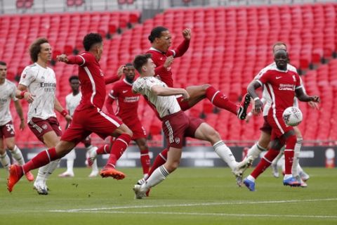 Liverpool's Virgil van Dijk, centre, scores a disallowed goal during the English FA Community Shield soccer match between Arsenal and Liverpool at Wembley stadium in London, Saturday, Aug. 29, 2020. (Andrew Couldridge/Pool via AP)