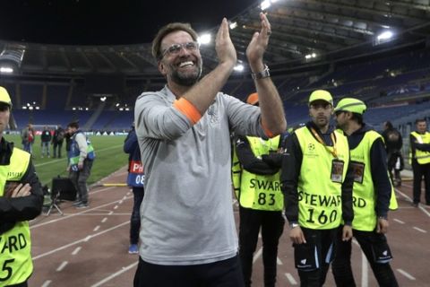 Liverpool coach Jurgen Klopp celebrates with the supporters at the end of the Champions League semifinal second leg soccer match between Roma and Liverpool at the Olympic Stadium in Rome, Wednesday, May 2, 2018. (AP Photo/Alessandra Tarantino)