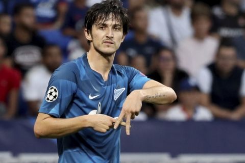 Zenit's Sardar Azmoun celebrates after scoring his side's opening goal during the group G Champions League soccer match between Lyon and Zenit St Petersburg at the Lyon Olympic Stadium in Lyon, France, Tuesday, Sept. 17, 2019. (AP Photo/Laurent Cipriani)