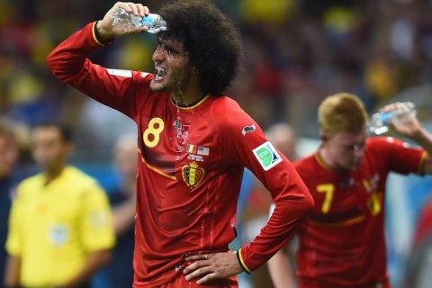 SALVADOR, BRAZIL - JULY 01:  Marouane Fellaini of Belgium takes on fluids during the 2014 FIFA World Cup Brazil Round of 16 match between Belgium and the United States at Arena Fonte Nova on July 1, 2014 in Salvador, Brazil.  (Photo by Jamie McDonald/Getty Images)