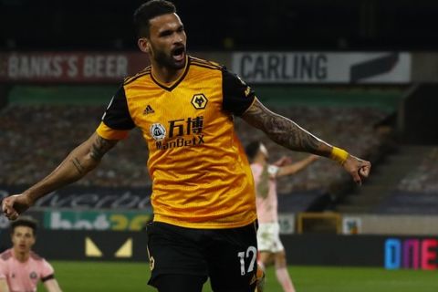Wolverhampton Wanderers' Willian Jose celebrates after scoring his side's opening goal during the English Premier League soccer match between Wolves and Sheffield United at the Molineux Stadium in Wolverhampton, England, Saturday, April 17, 2021. (Jason Cairnduff/Pool via AP)