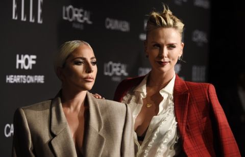 Lady Gaga, left, and actress Charlize Theron pose together at the 25th Annual ELLE Women in Hollywood Celebration, Monday, Oct. 15, 2018, in Los Angeles. (Photo by Chris Pizzello/Invision/AP)
