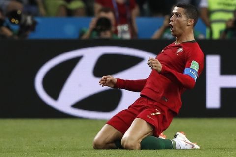 Portugal's Cristiano Ronaldo celebrates after scoring his sides 2nd goal of the game during the group B match between Portugal and Spain at the 2018 soccer World Cup in the Fisht Stadium in Sochi, Russia, Friday, June 15, 2018. (AP Photo/Manu Fernandez)