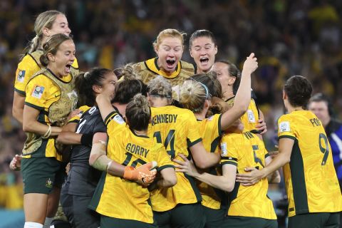 Australia players celebrate after winning the Women's World Cup quarterfinal soccer match between Australia and France in Brisbane, Australia, Saturday, Aug. 12, 2023. (AP Photo/Tertius Pickard)