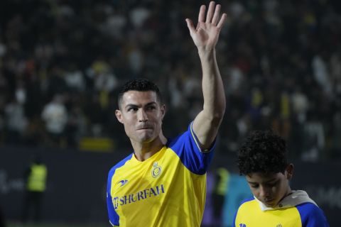 Cristiano Ronaldo reacts during his official unveiling as a new member of Al Nassr soccer club in in Riyadh, Saudi Arabia, Tuesday, Jan. 3, 2023.Ronaldo, who has won five Ballon d'Ors awards for the best soccer player in the world and five Champions League titles, will play outside of Europe for the first time in his storied career. (AP Photo/Amr Nabil)