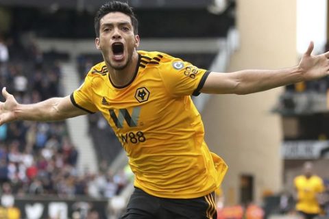 Wolverhampton Wanderers' Raul Jimenez celebrates scoring his side's first goal of the game during the English Premier League soccer match between Wolverhampton Wanderers and Burnley, at Molineux, in Wolverhampton, England,  Sunday Sept. 16, 2018. (Nick Potts/PA via AP)