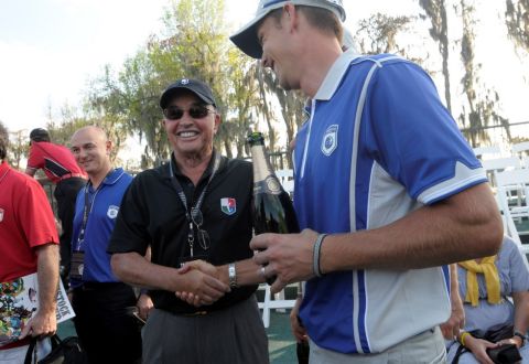 Lake Nona team member Henrik Stenson, right, of Sweden, shakes hands with Tavistock founder Joe Lewis during the second day of the Tavistock Cup golf tournament in Windermere, Fla., Tuesday, March 15, 2011.(AP Photo/Phelan M. Ebenhack)