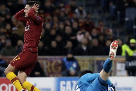 Roma forward Cengiz Under reacts past Real goalkeeper Thibaut Courtois during a Champions League, Group G soccer match between Roma and Real Madrid at the Rome Olympic stadium, Tuesday, Nov. 27, 2018. (AP Photo/Gregorio Borgia)