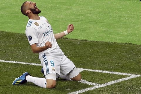 Real Madrid's Karim Benzema celebrates after scoring the opening goal during the Champions League Final soccer match between Real Madrid and Liverpool at the Olimpiyskiy Stadium in Kiev, Ukraine, Saturday, May 26, 2018. (AP Photo/Darko Vojinovic)