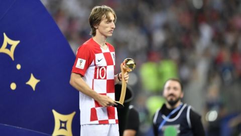 Croatia's Luka Modric holds the golden ball as best player of the tournament after his team lost the the final match between France and Croatia at the 2018 soccer World Cup in the Luzhniki Stadium in Moscow, Russia, Sunday, July 15, 2018. (AP Photo/Martin Meissner)