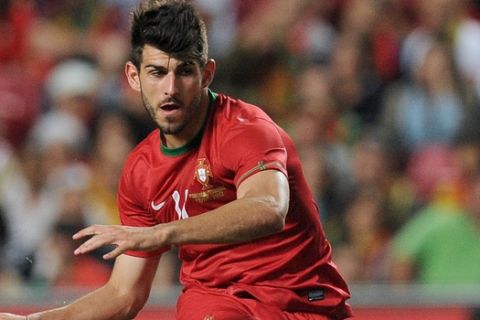 Portugal's player Nelson Oliveira attempts a shot at goal during their friendly soccer match with Turkey, Saturday, June 2 2012, at the Luz stadium in Lisbon. (AP Photo/Paulo Duarte)