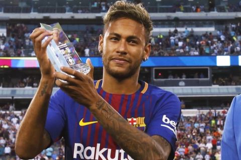 IMAGE DISTRIBUTED FOR INTERNATIONAL CHAMPIONS CUP - FC Barcelona's Neymar (right) hold the "Man of the Match" trophy he received from Heineken Brand Manager Rob Ryder during a match against Juventus during the 2017 International Champions Cup on Saturday, July 22, 2017, in East Rutherford, N.J. (Adam Hunger/AP Images for International Champions Cup)