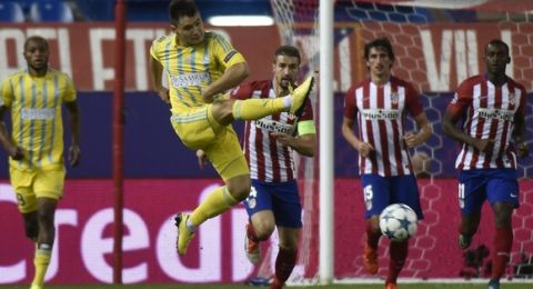 Astana's midfielder midfielder Georgy Zhukov controls the ball during the UEFA Champions League group C football match Club Atletico de Madrid vs FC Astana at the Vicente Calderon stadium in Madrid on October 21, 2015.  AFP PHOTO / PEDRO ARMESTRE        (Photo credit should read PEDRO ARMESTRE/AFP/Getty Images)
