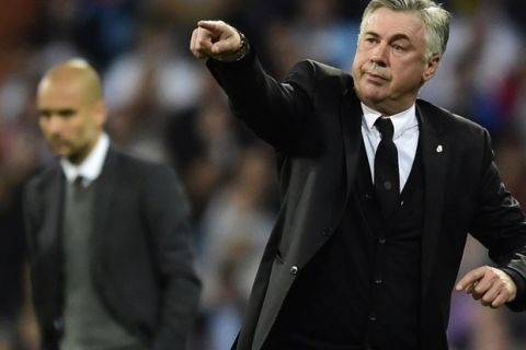 Real Madrid's Italian coach Carlo Ancelotti gestures during the UEFA Champions League semifinal first leg football match Real Madrid CF vs FC Bayern Munchen at the Santiago Bernabeu stadium in Madrid on April 23, 2014.   AFP PHOTO/ JAVIER SORIANO        (Photo credit should read JAVIER SORIANO/AFP/Getty Images)