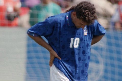 Italy's Roberto Baggio hangs his head at the end of overtime against Brazil, in the finals of the XV World Cup at the Rose Bowl in Pasadena Calif., Sunday, July 17, 1994. Baggio later missed on his shot on goal in the shootout, resulting in Brazil's 3-2 loss. (AP Photo/Michael Probst)