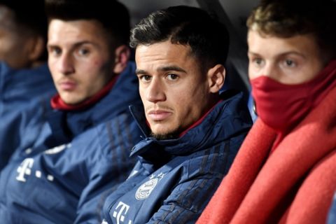 Bayern's Philippe Coutinho sits on the bench before the German soccer cup, DFB Pokal, second round match between VfL Bochum and Bayern Munich at the Vonovia Ruhrstadion stadium, in Bochum, Germany, Tuesday, Oct. 29, 2019. (AP Photo/Martin Meissner)